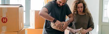 Couple unpacking their boxes after moving.