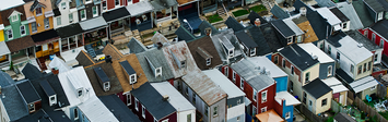 Street with colorful rowhouses.