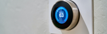 Smart thermostat on wall.