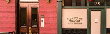 View of empty storefront on street.