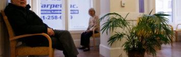 Older adults sitting in waiting room.