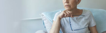 Older woman sitting on a chair