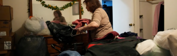 Woman unpacking suitcase 