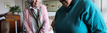 Two older adults in a room