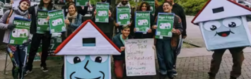 Activists gathering signatures to put Seattle social housing initiative on the ballot.